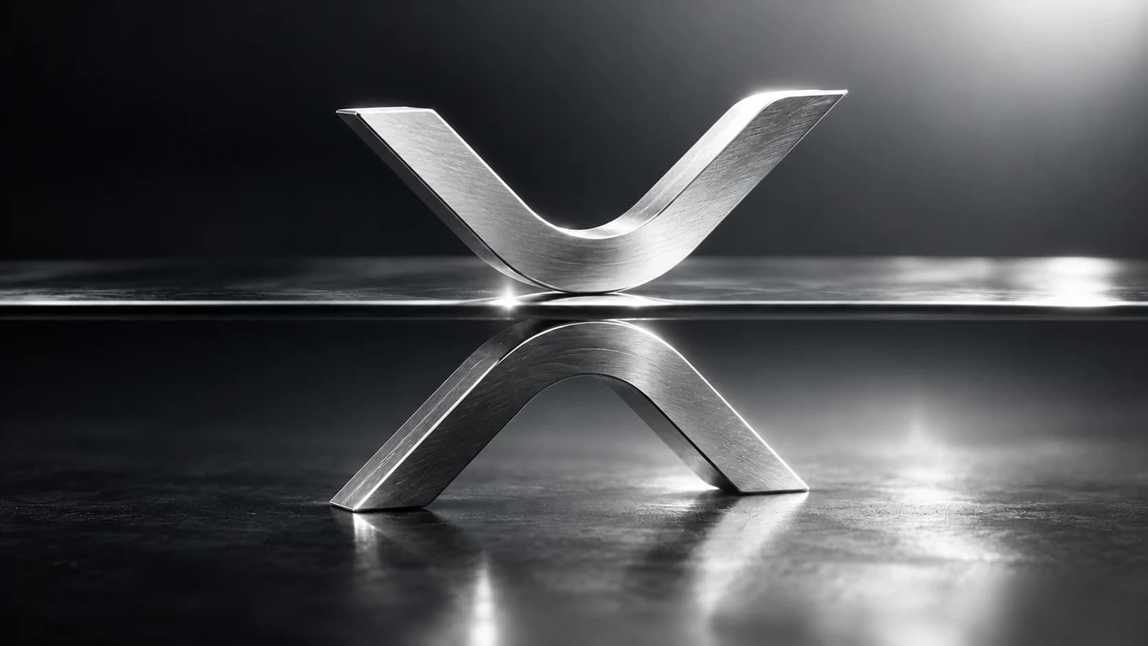 A silver XRP symbol meeting a thin glass plane in a charcoal studio setting.
